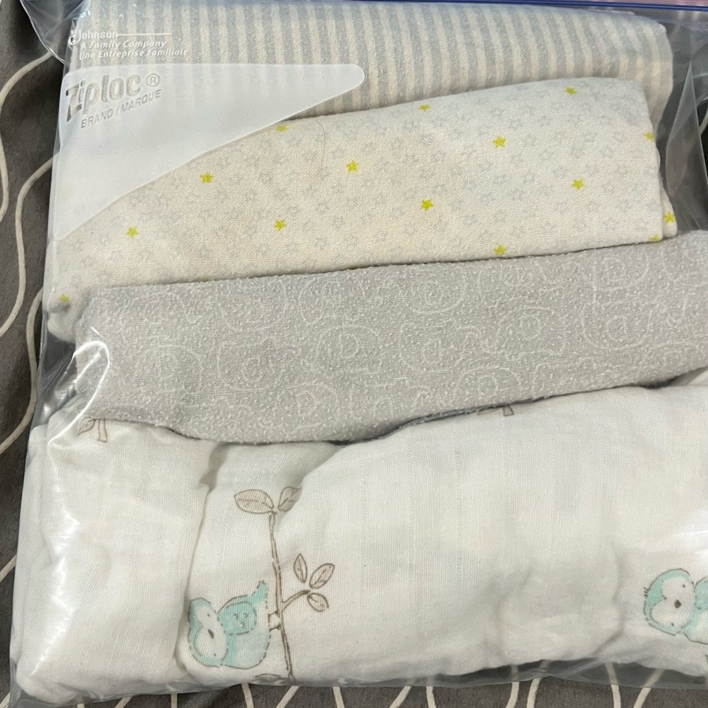 2 bags of receiving blankets. No animals or smoking, organic laundry detergent.